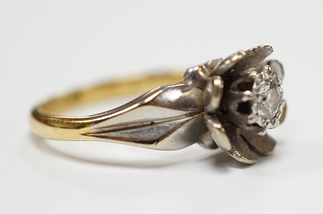 An 18ct gold and illusion set diamond flower head ring, size L, gross weight 4.7 grams.